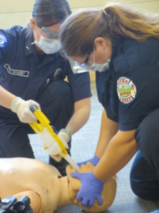 volunteer EMTs practicing intubation