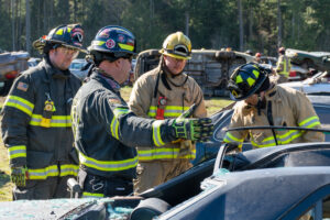 Volunteer firefighter training exercise with an active crew practicing hands-on skills.